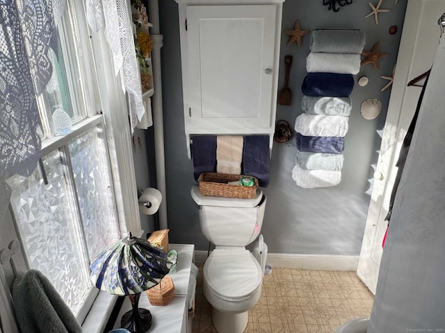 bathroom with tile patterned floors and toilet