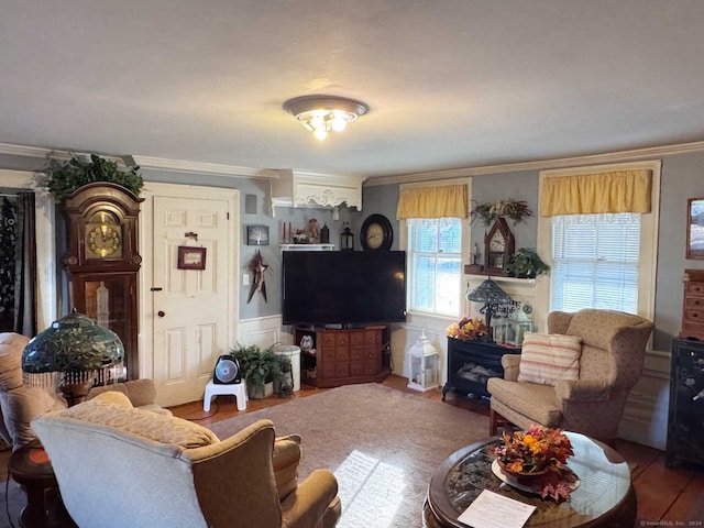 living room with hardwood / wood-style floors and ornamental molding