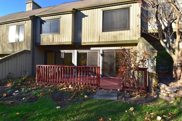 back of house featuring a deck