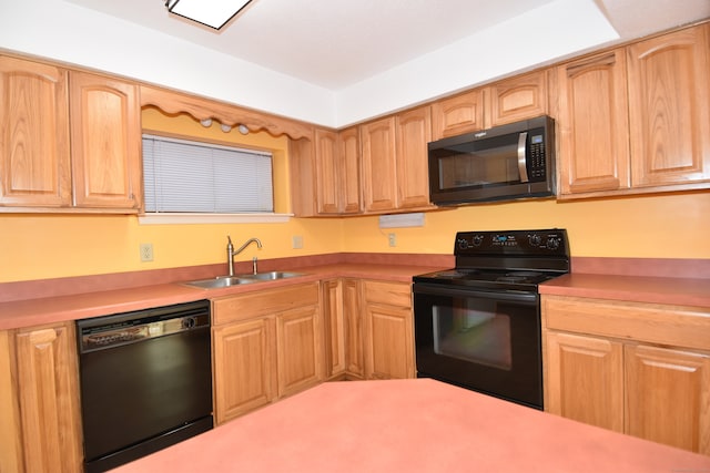 kitchen featuring sink and black appliances