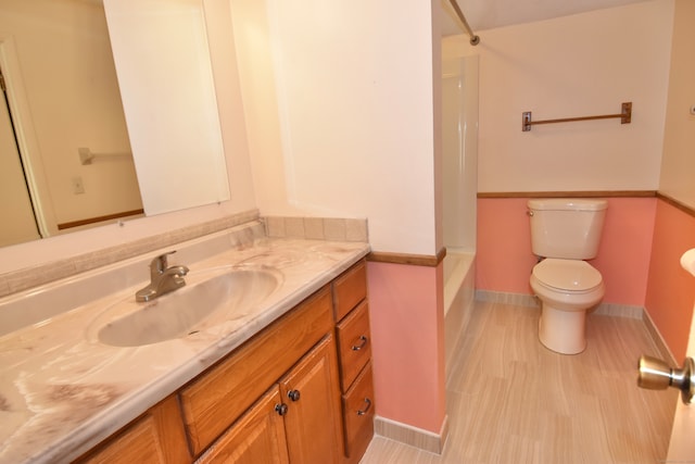 full bathroom featuring shower / bathing tub combination, vanity, toilet, and hardwood / wood-style floors