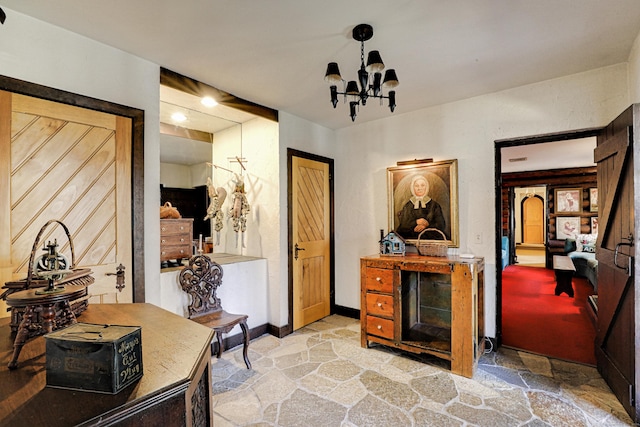 87 Red Coat Rd, Westport, CT 06880 - hall with stone floors and a chandelier