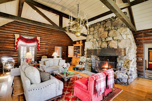 87 Red Coat Rd, Westport, CT 06880 - living room with a chandelier, hardwood / wood-style floors, a fireplace, log walls, and high vaulted ceiling