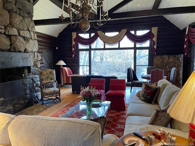 87 Red Coat Rd, Westport, CT 06880 - living room featuring a fireplace, a chandelier, wood ceiling, and wood finished floors