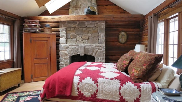 87 Red Coat Rd, Westport, CT 06880 - bedroom with vaulted ceiling, light wood-style floors, and a fireplace