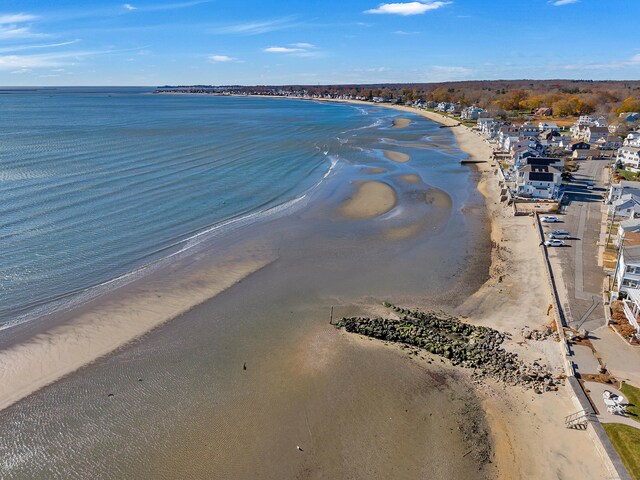 birds eye view of property featuring a view of the beach and a water view