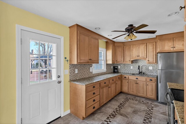 140 Salt Island Rd, Westbrook, CT 06498 - kitchen with a sink, stainless steel appliances, a ceiling fan, decorative backsplash, and light tile patterned flooring