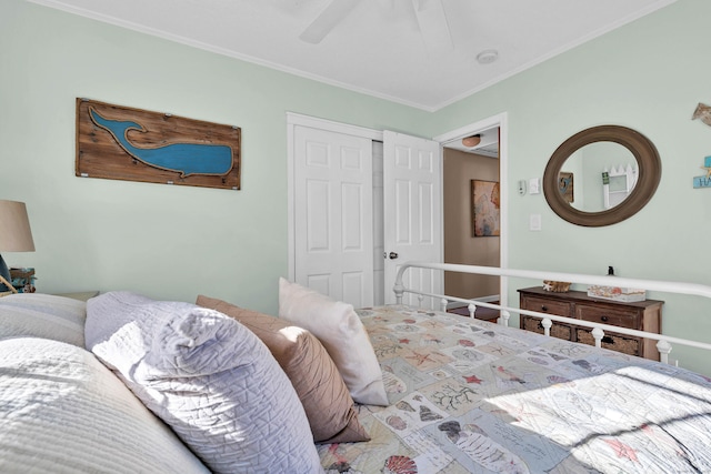 bedroom with ceiling fan, a closet, and crown molding