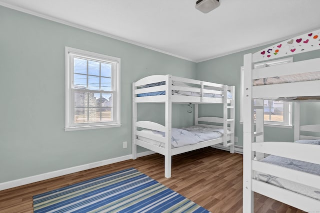 bedroom featuring crown molding and hardwood / wood-style floors