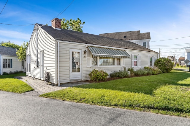 140 Salt Island Rd, Westbrook, CT 06498 - view of front facade featuring a chimney, a front lawn, and roof with shingles