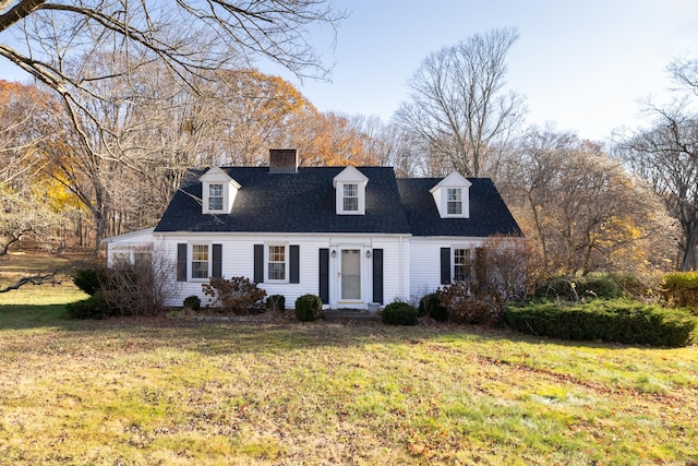 new england style home featuring a front lawn