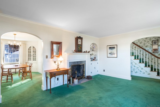 living room with a chandelier, carpet floors, and crown molding