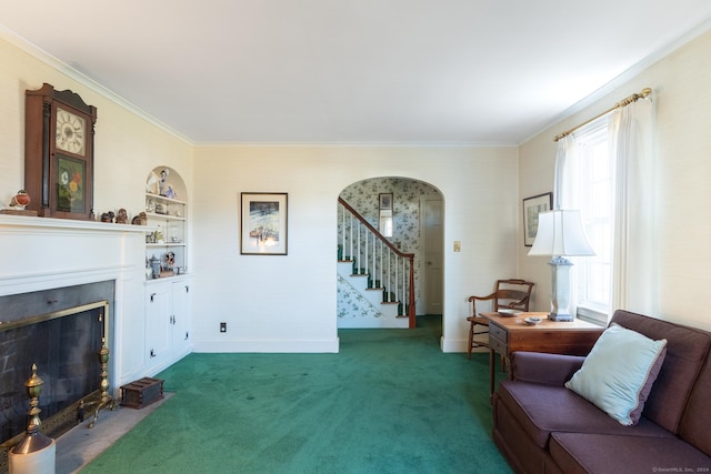 living room featuring built in features, dark carpet, and ornamental molding