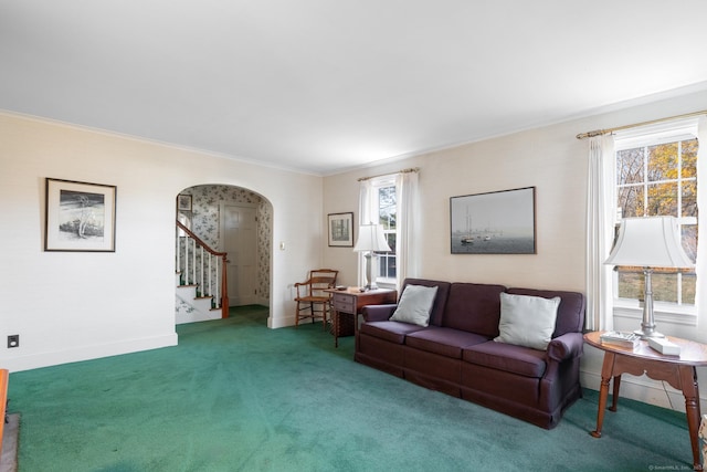 carpeted living room with ornamental molding