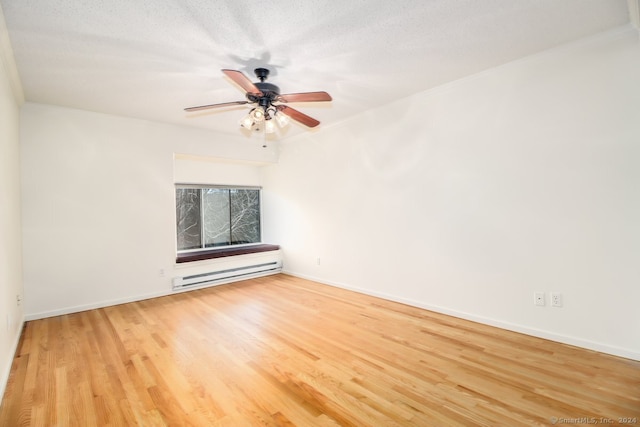 unfurnished room with ceiling fan, hardwood / wood-style flooring, a baseboard radiator, and a textured ceiling