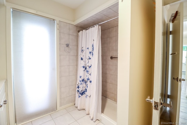 bathroom featuring tile patterned floors and walk in shower