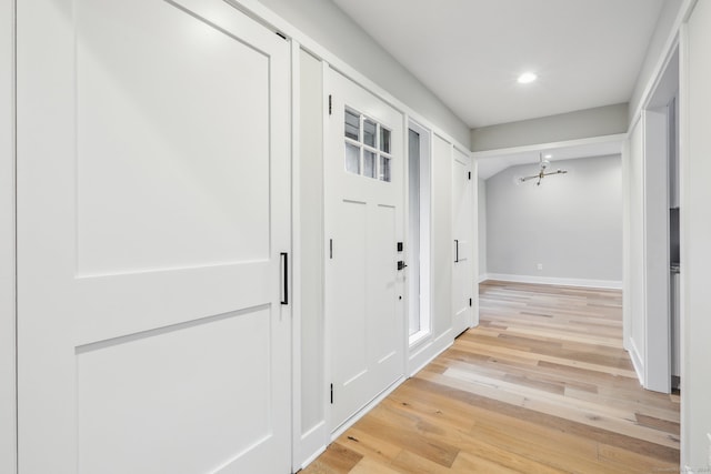 hall with light wood-type flooring