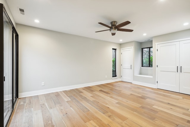 unfurnished bedroom featuring ceiling fan and light hardwood / wood-style flooring