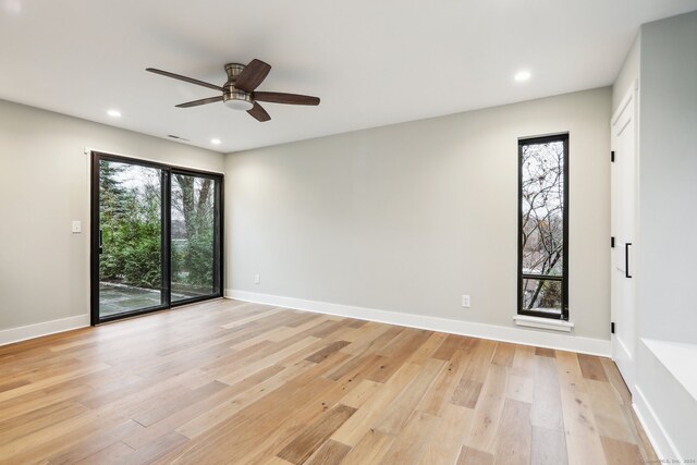 unfurnished room featuring ceiling fan and light hardwood / wood-style flooring