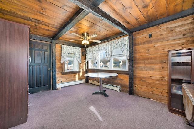 misc room with carpet flooring, beam ceiling, wood walls, and a baseboard radiator