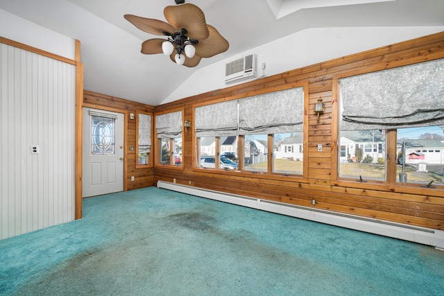 interior space featuring ceiling fan, a wall mounted air conditioner, baseboard heating, lofted ceiling, and wooden walls