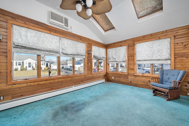 unfurnished sunroom featuring an AC wall unit, ceiling fan, a baseboard heating unit, and vaulted ceiling with skylight