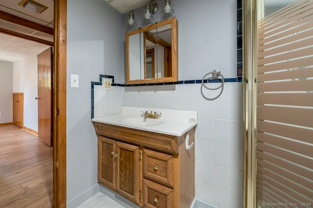 bathroom featuring vanity and hardwood / wood-style flooring