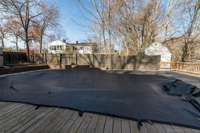 view of pool with a wooden deck