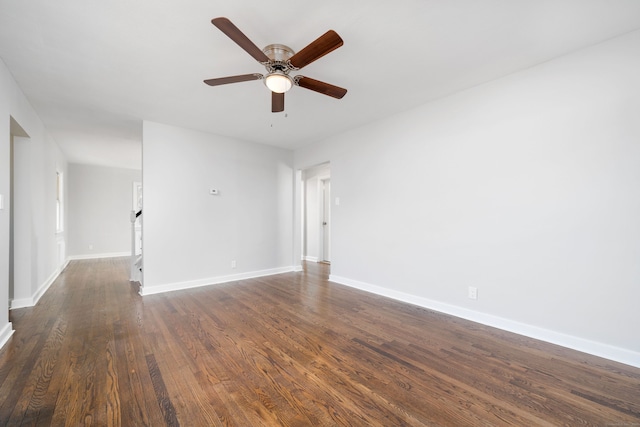 unfurnished room with dark hardwood / wood-style floors and ceiling fan