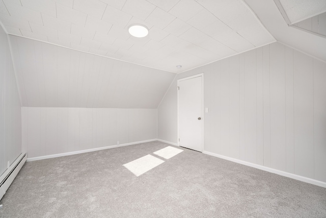 bonus room with carpet floors, a baseboard radiator, and lofted ceiling