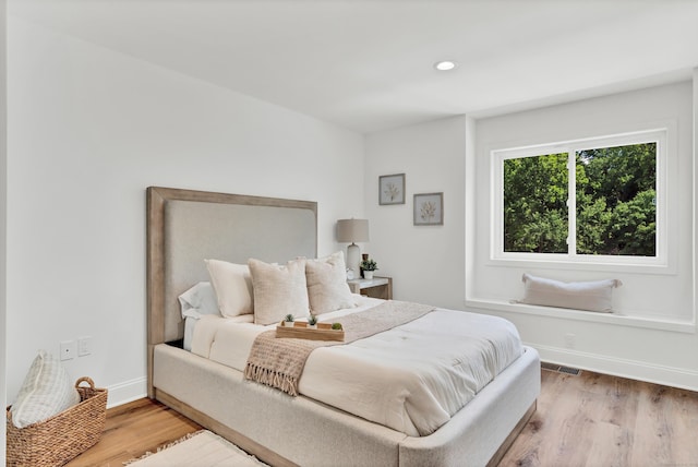 bedroom with light hardwood / wood-style floors