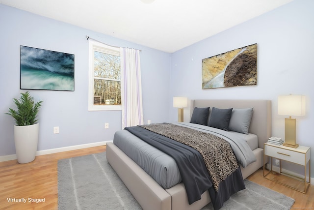 bedroom with hardwood / wood-style floors