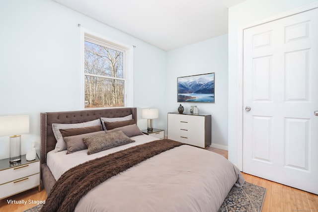 bedroom with light wood-type flooring