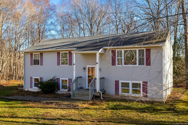 bi-level home with a front lawn