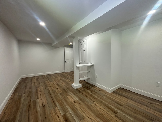 basement featuring dark hardwood / wood-style floors