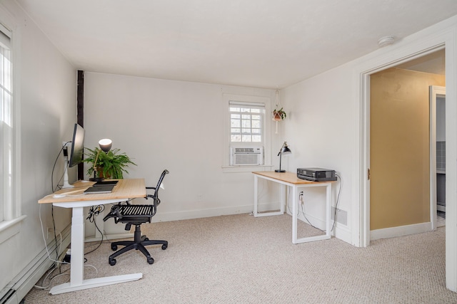 office with baseboard heating, cooling unit, and light carpet