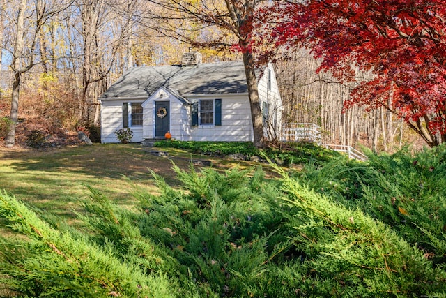 ranch-style home with a front lawn