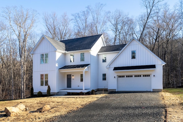 modern inspired farmhouse featuring a porch and a garage