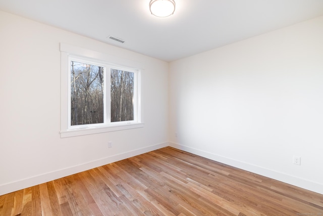 empty room with light wood-type flooring