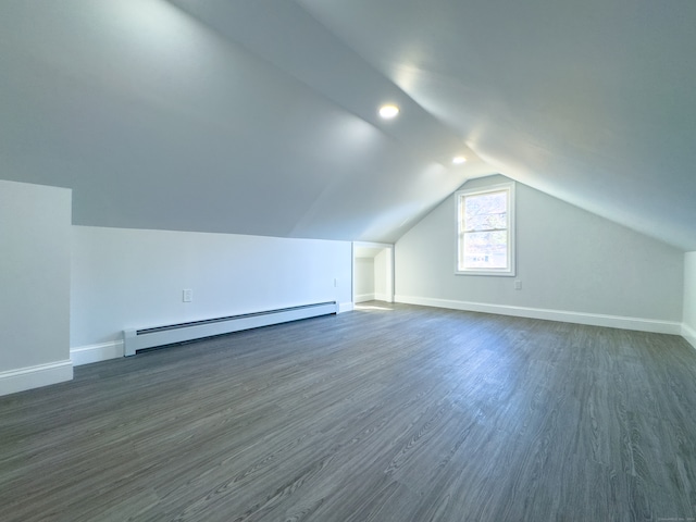 bonus room featuring a baseboard radiator, dark hardwood / wood-style floors, and lofted ceiling