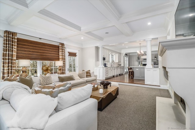 living room with coffered ceiling, crown molding, beam ceiling, a notable chandelier, and dark hardwood / wood-style floors