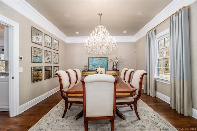 dining space featuring dark hardwood / wood-style floors, an inviting chandelier, and ornamental molding