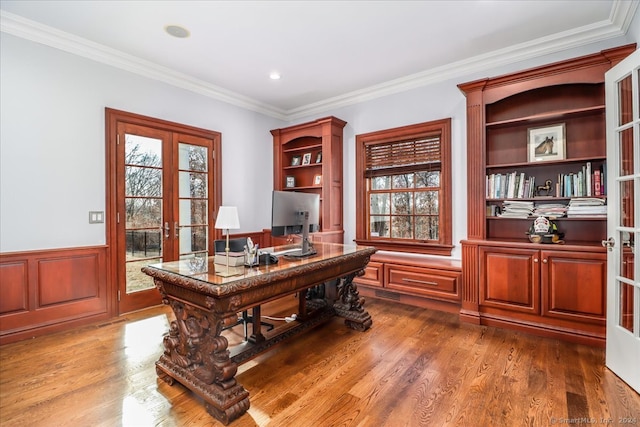 office area featuring french doors, crown molding, and hardwood / wood-style floors