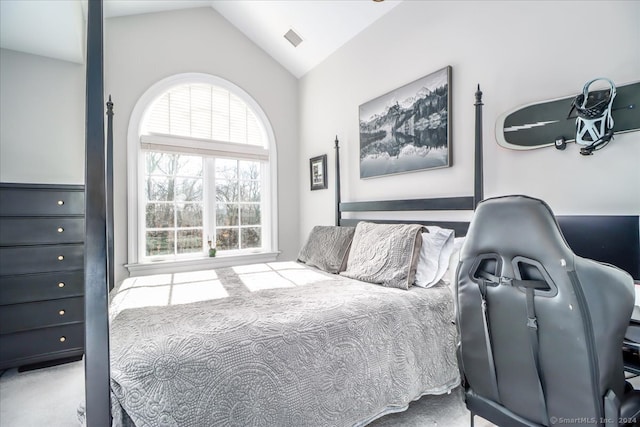 bedroom featuring carpet flooring and lofted ceiling