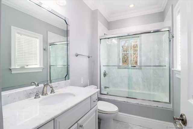 full bathroom featuring vanity, toilet, crown molding, and combined bath / shower with glass door