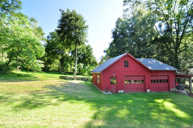 garage featuring a lawn