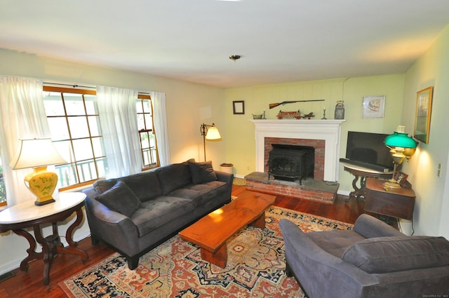 living room with wood-type flooring and a wood stove