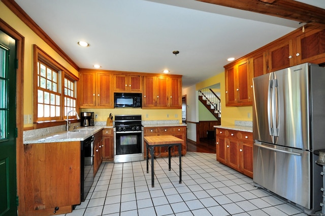 kitchen with black appliances, crown molding, sink, light stone countertops, and light tile patterned floors