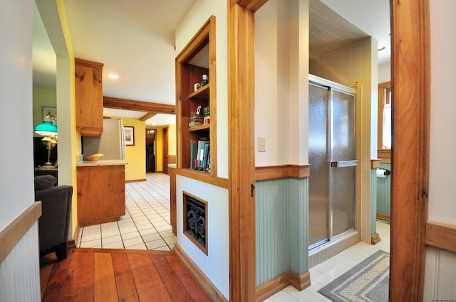 corridor with light hardwood / wood-style floors