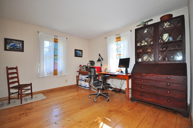 office space with light hardwood / wood-style flooring